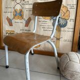 Old wooden and metal children's school chair