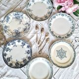 Assiettes à dessert anciennes en terre de ferré accompagnées d'un plat