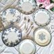 Antique earthenware dessert plates accompanied by a dish