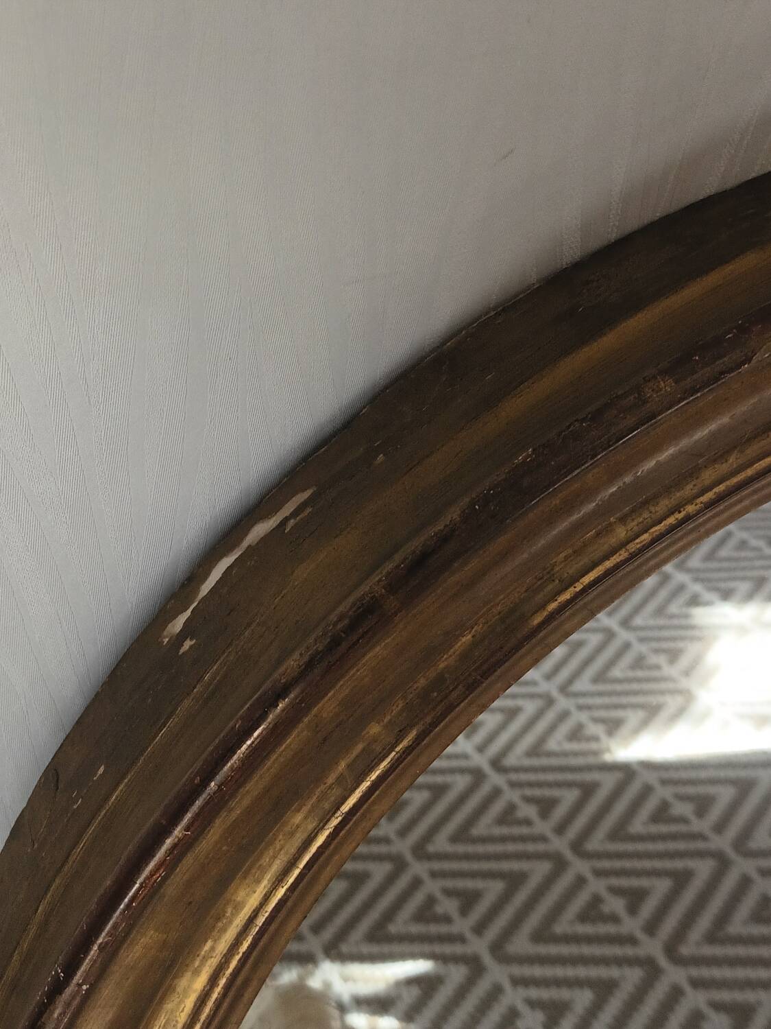 Antique oval gilded stucco mirror