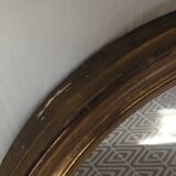 Antique oval gilded stucco mirror