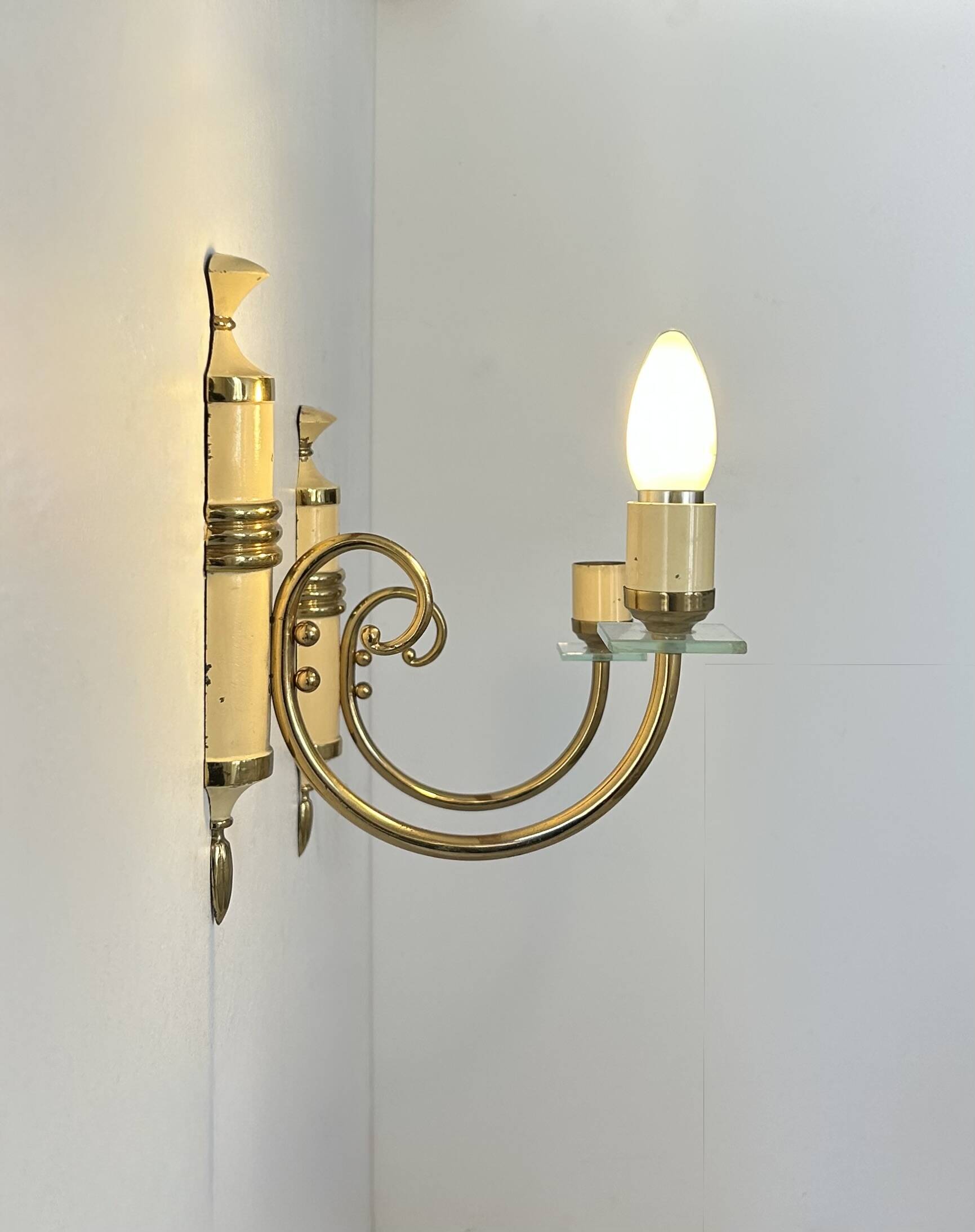 Pair of vintage patinated brass wall lights, France, 1940s