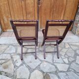 2 vintage caned folding chairs
