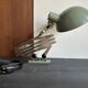 Old extendable accordion lamp in celadon green, workshop spirit.