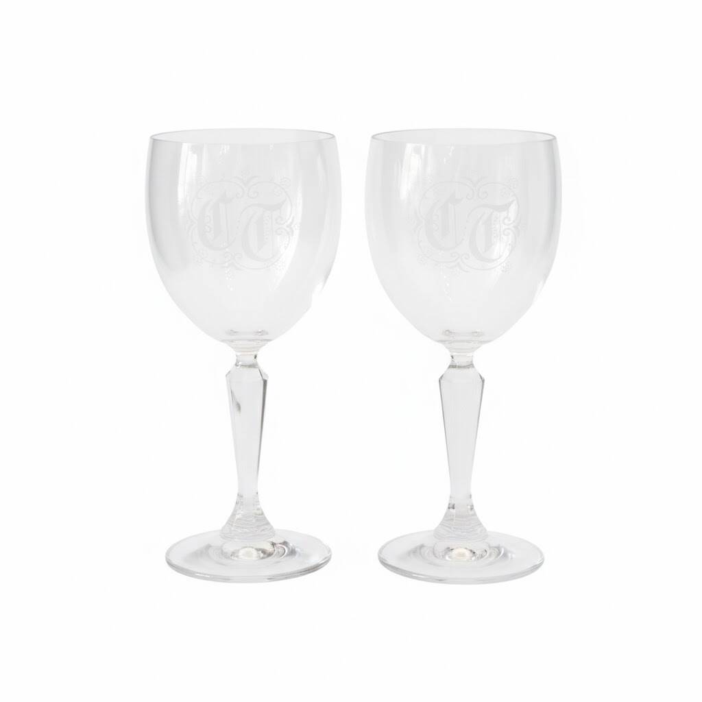 A pair of engraved crystal wine glasses