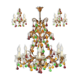Lustrous chandelier with two wall lights decorated with foliage and pendants.