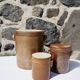 Trio of stoneware pots with lids
