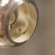 Two Space-Age hanging lamps, in silver-coloured aluminium with orange prisms.