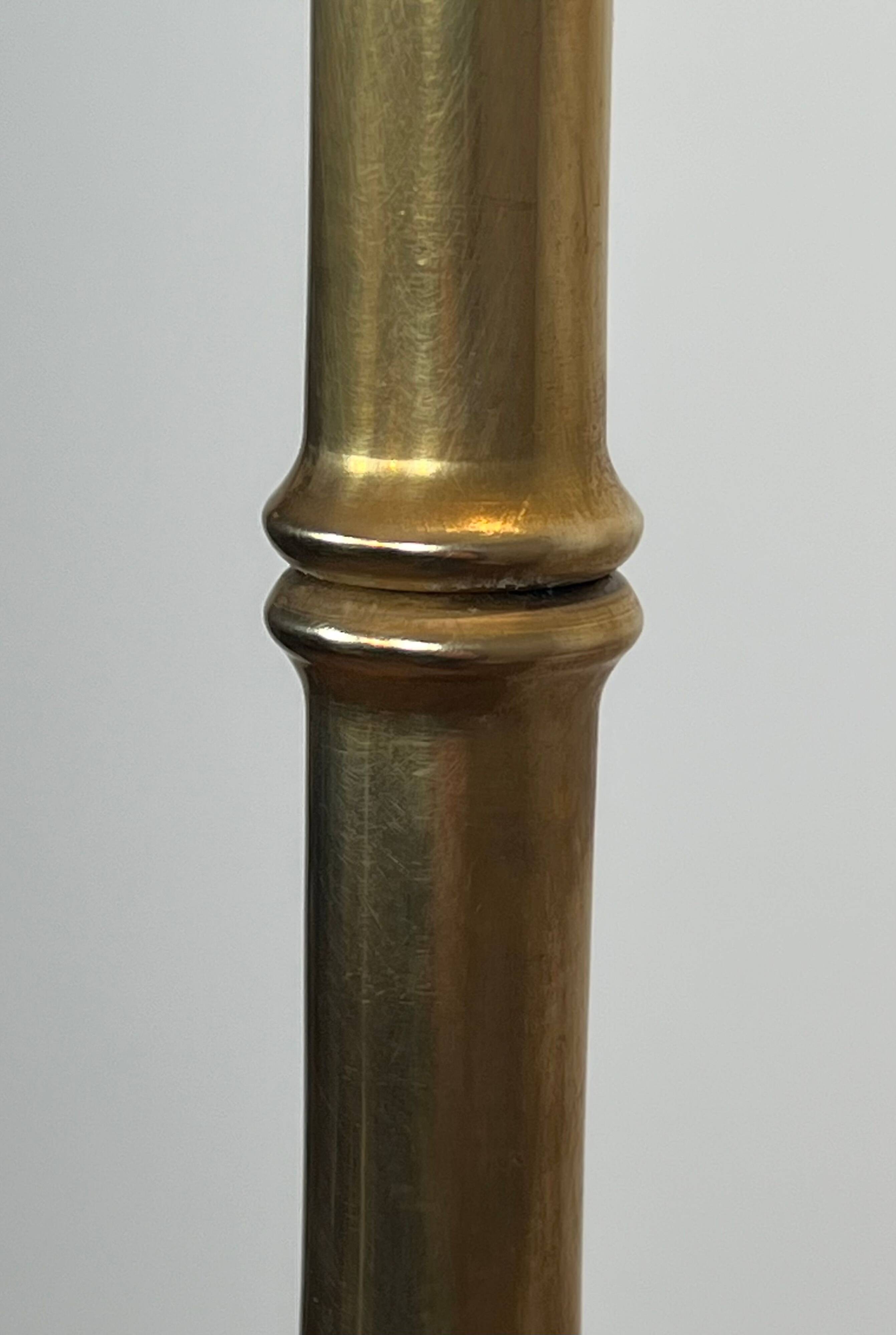 Pair of parquet floor lamps in faux-bamboo style in bronze and brass by Jacques Adnet.