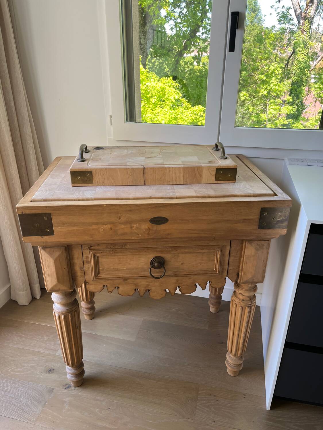 Genuine butcher's block made of solid wood with a knife drawer.