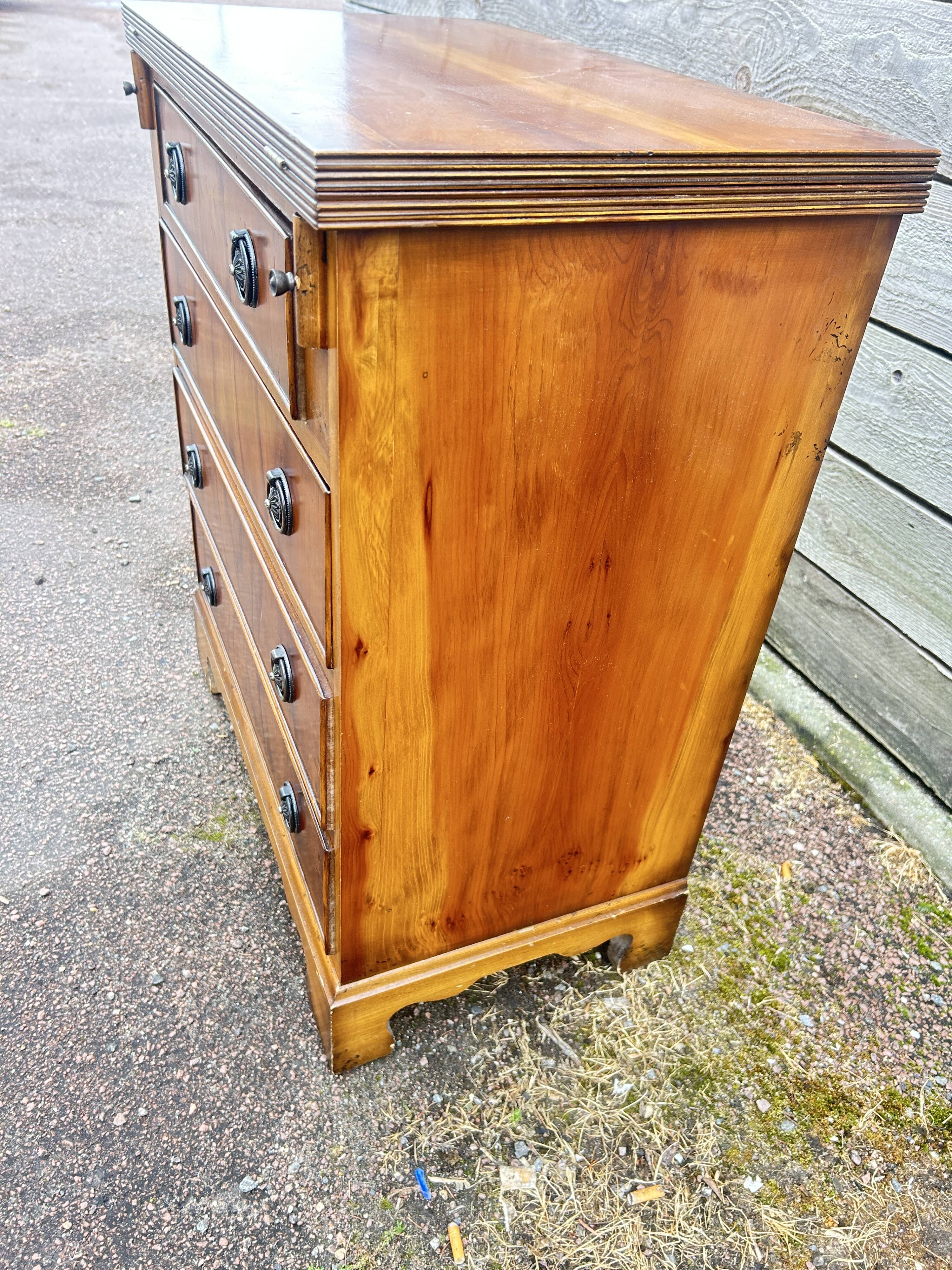 Small English chest of drawers with a folding top.