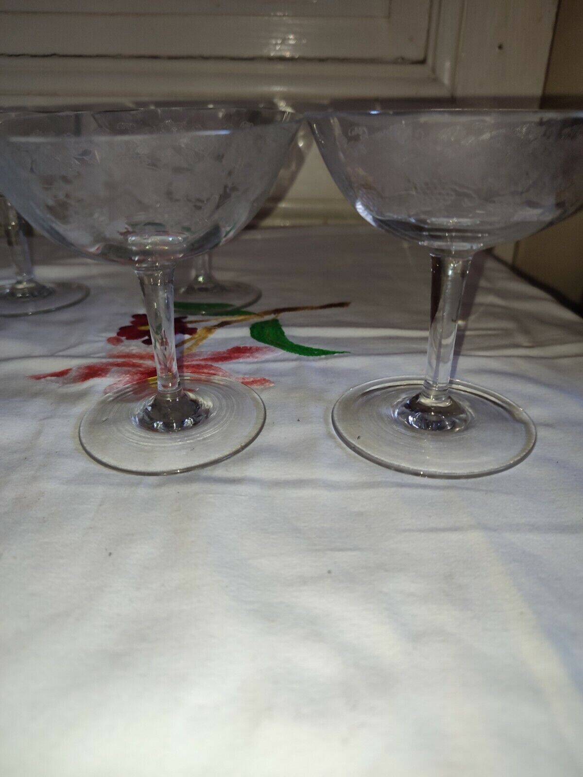 Beautiful set of seven crystal champagne glasses engraved with vine branches