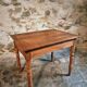 French vintage side table in cherry wood with a drawer.