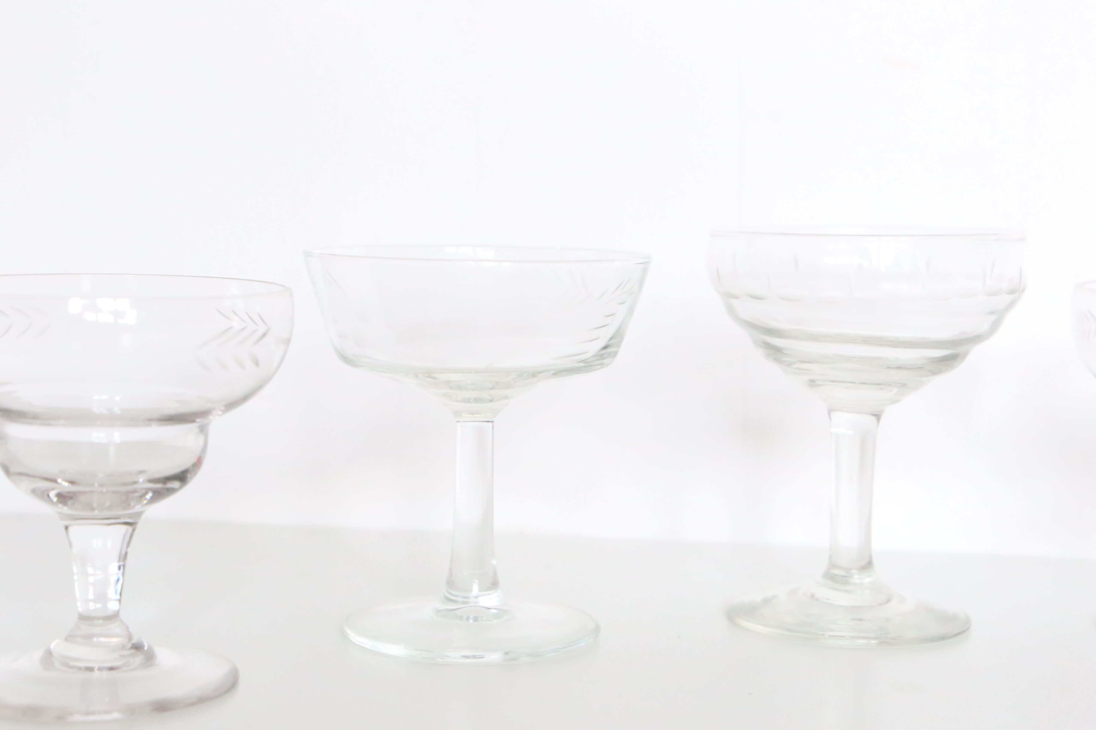 Set of 6 mismatched champagne glasses, chiseled glass