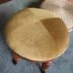 Upholstered stool on casters