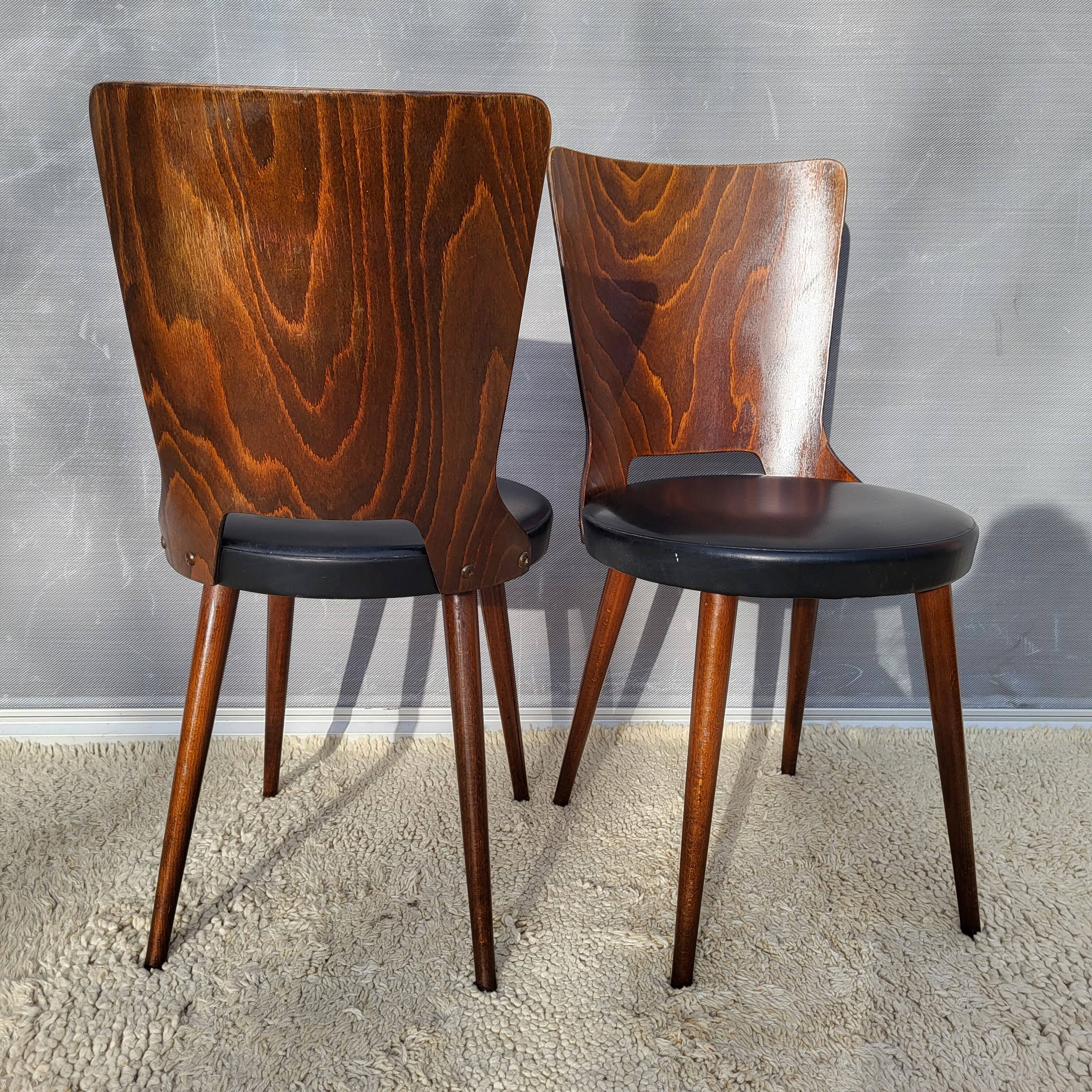 Pair of Dove chairs • Baumann • Black faux leather