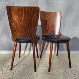 Pair of Dove chairs • Baumann • Black faux leather