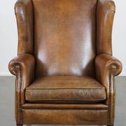 Sheepskin wing chair + XXL patinated footrest