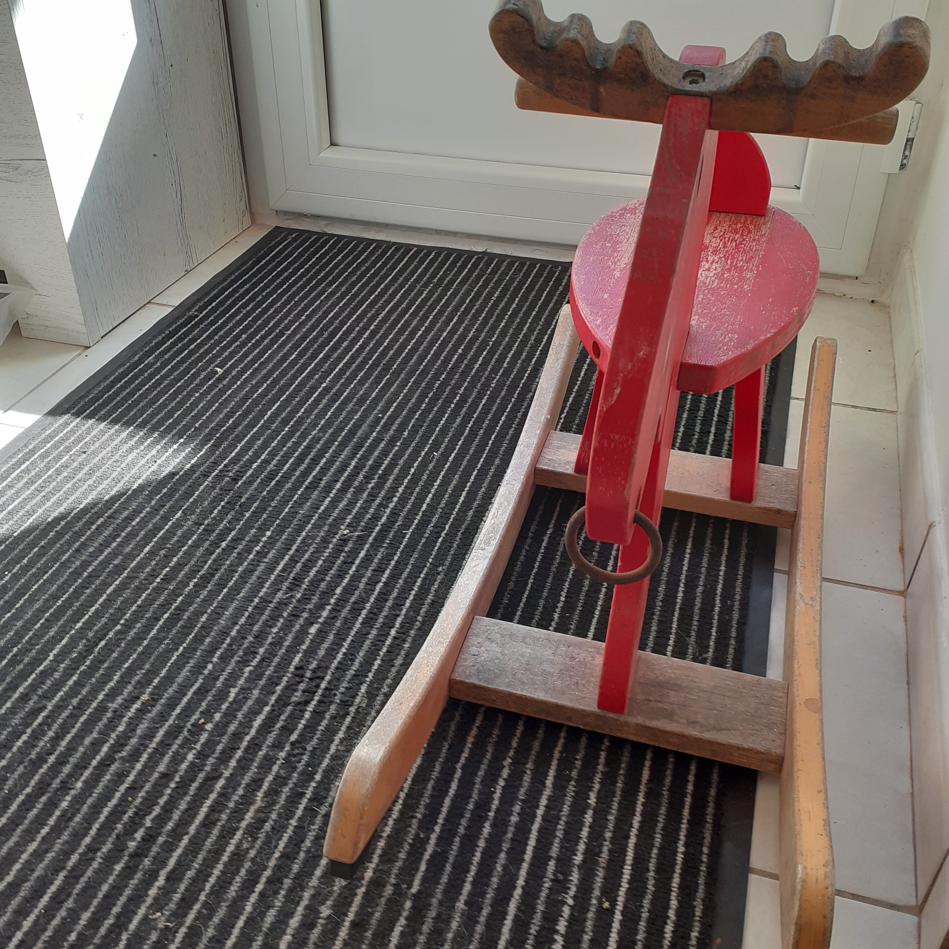 Old reindeer with wooden rocking