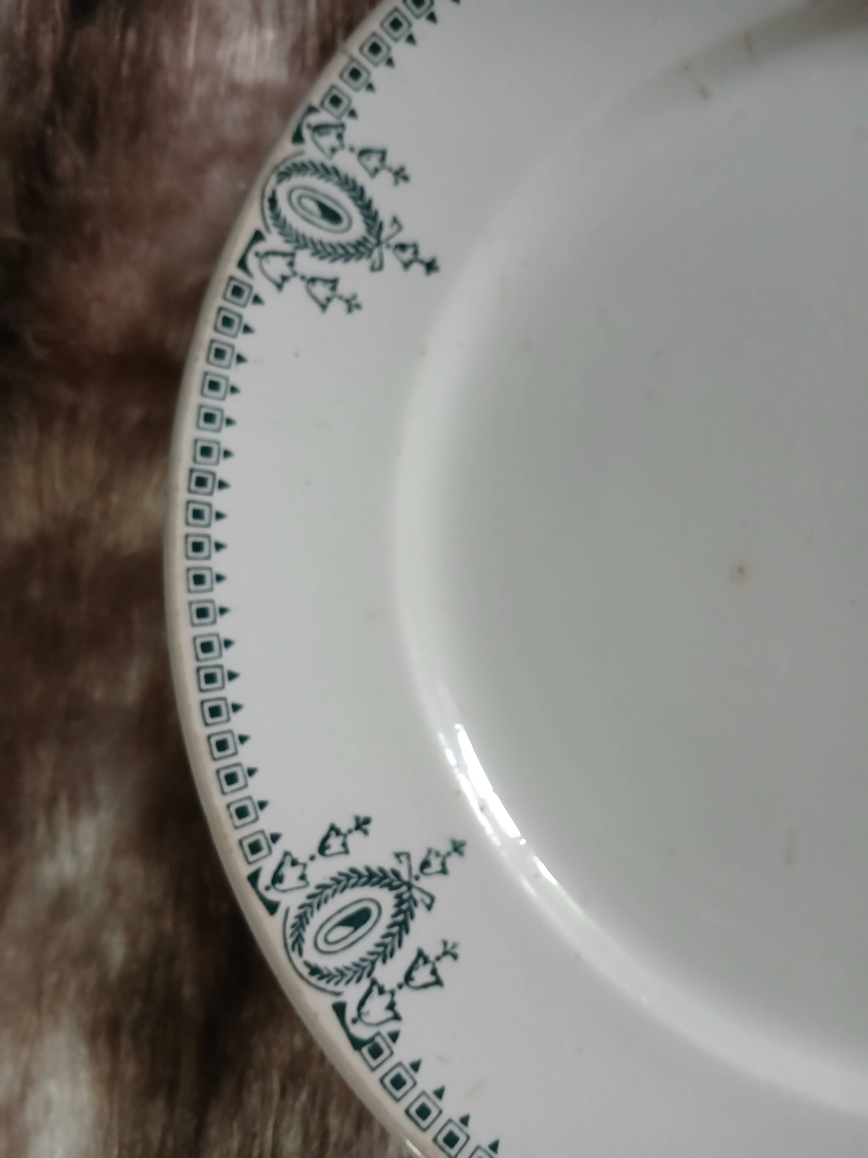 Old round plate made of ironstone
