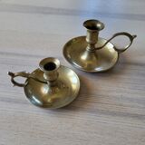 Paire de bougeoirs à poucier en laiton