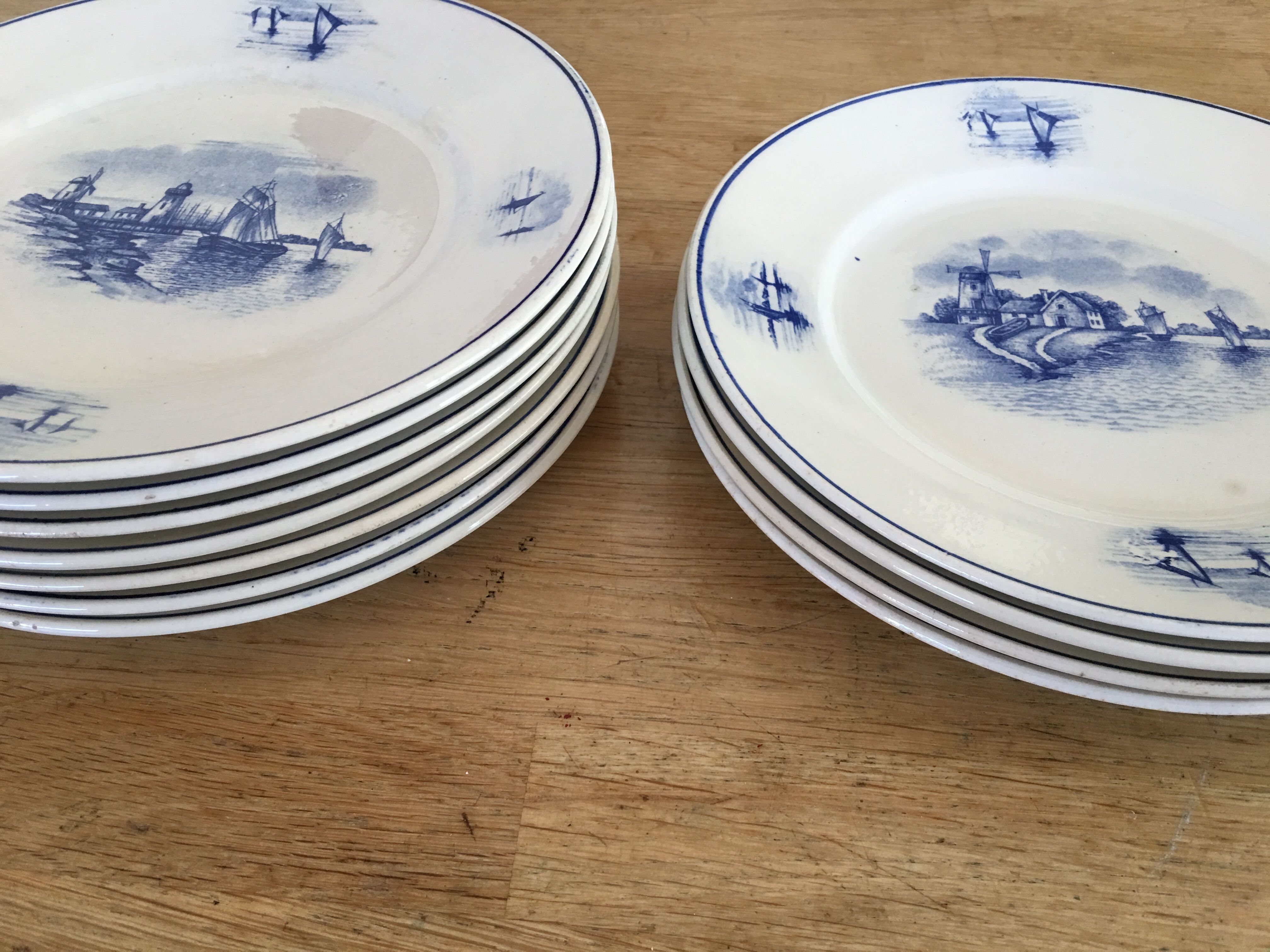 Series of 11 flat plates, Dutch earthenware, early XX