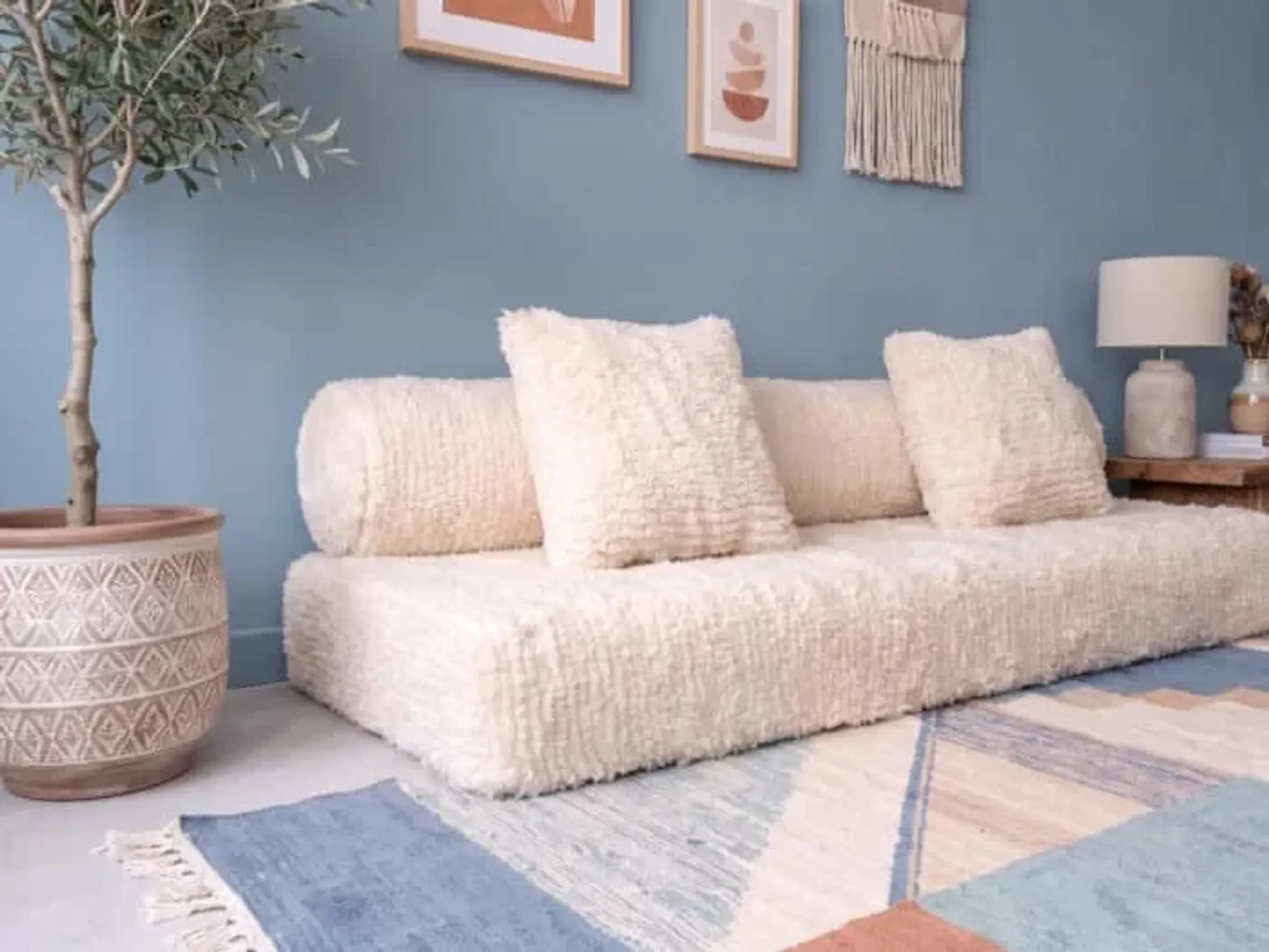 White Moroccan Arabic sofa with a rounded backrest.