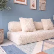 White Moroccan Arabic sofa with a rounded backrest.