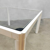 Plia' chairs by Giancarlo Piretti for Castelli with a table
