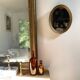 Oval mirror in gilded wood
