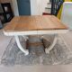 Restored oak table in natural wood and linen.