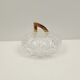 Round crystal box and a golden metal handle