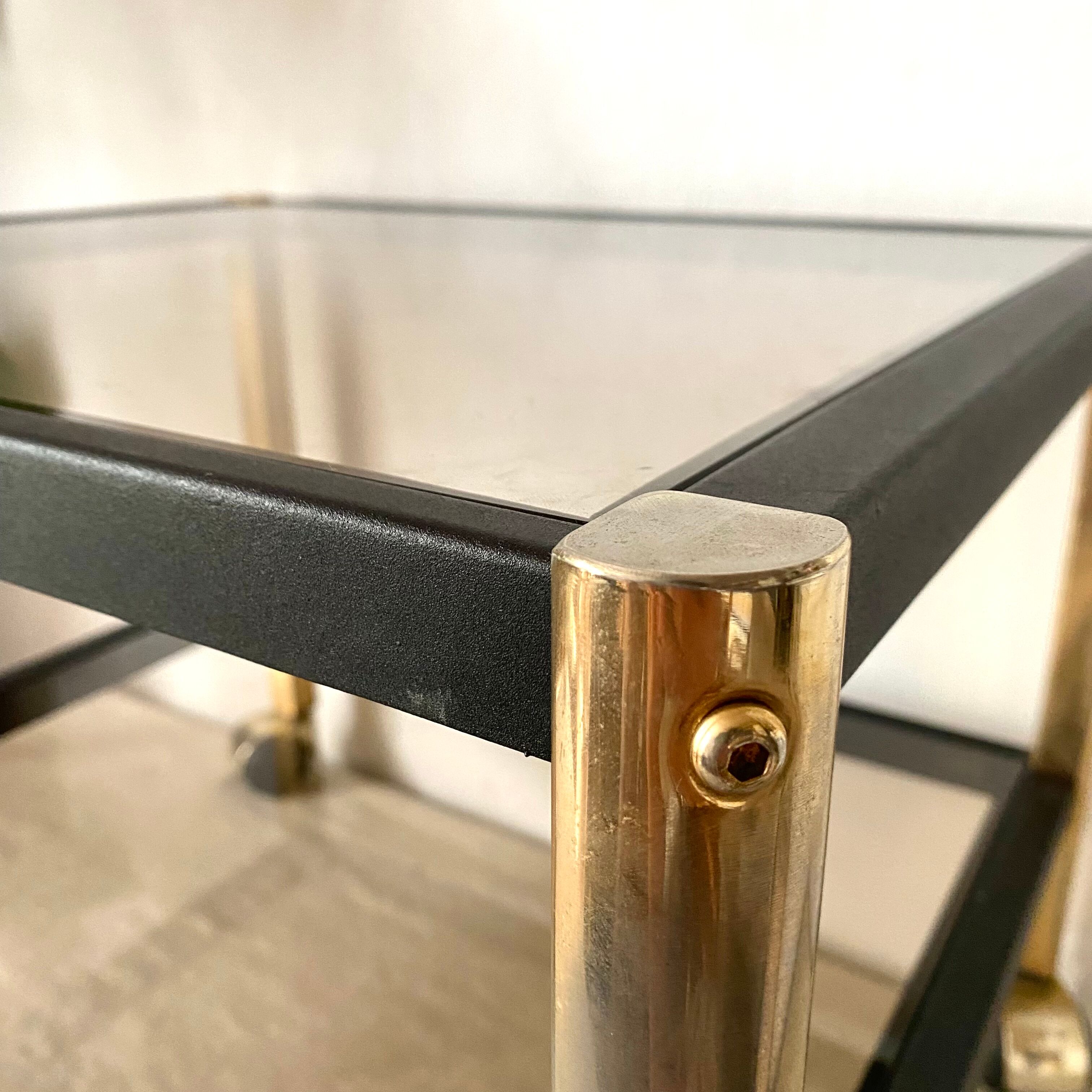 Serving with vintage wheels in metal and smoked glass