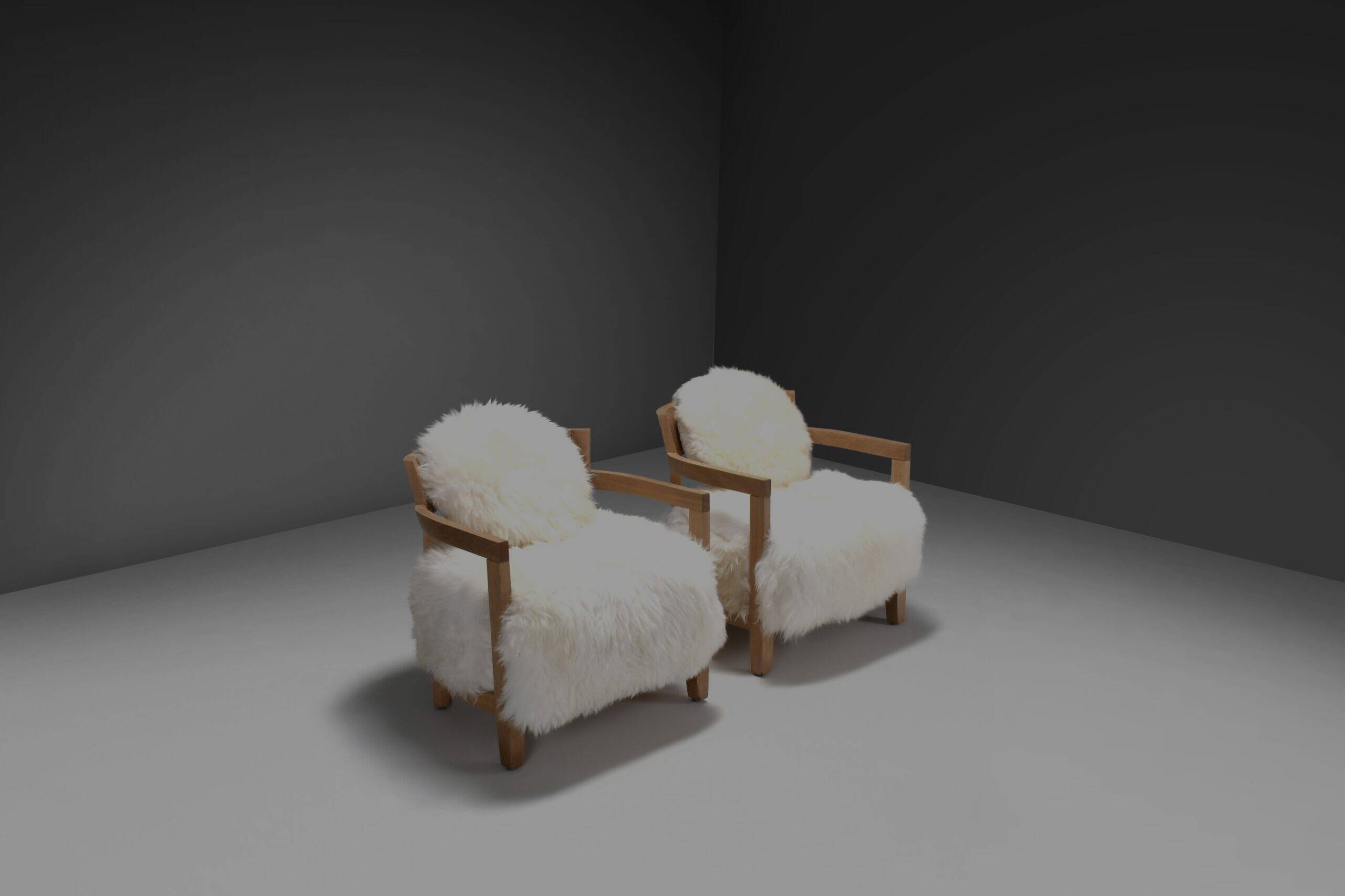 Set of two solid oak and off-white sheepskin chairs, Switzerland, 1970s