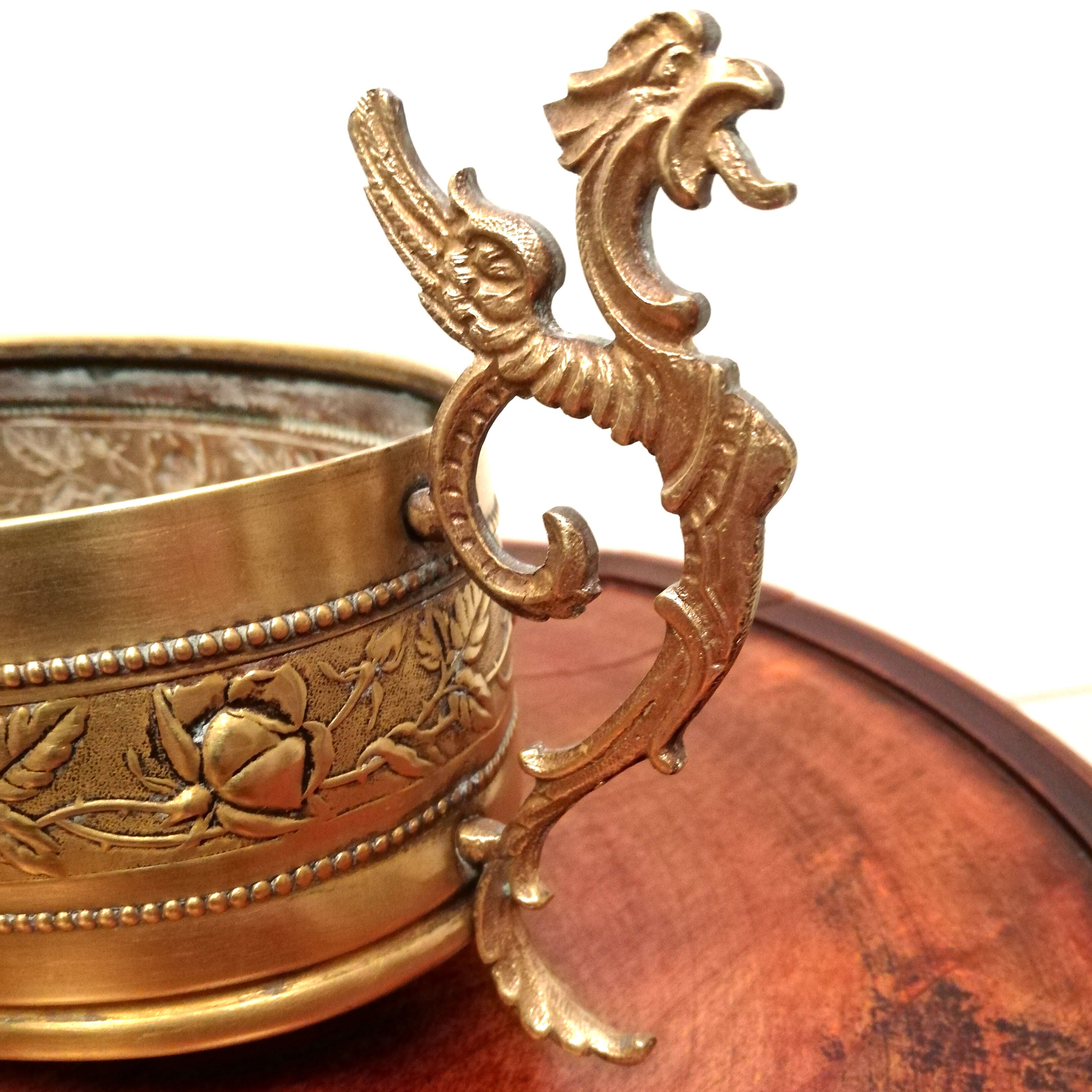 Repulsed brass planter with dragon-shaped handles
