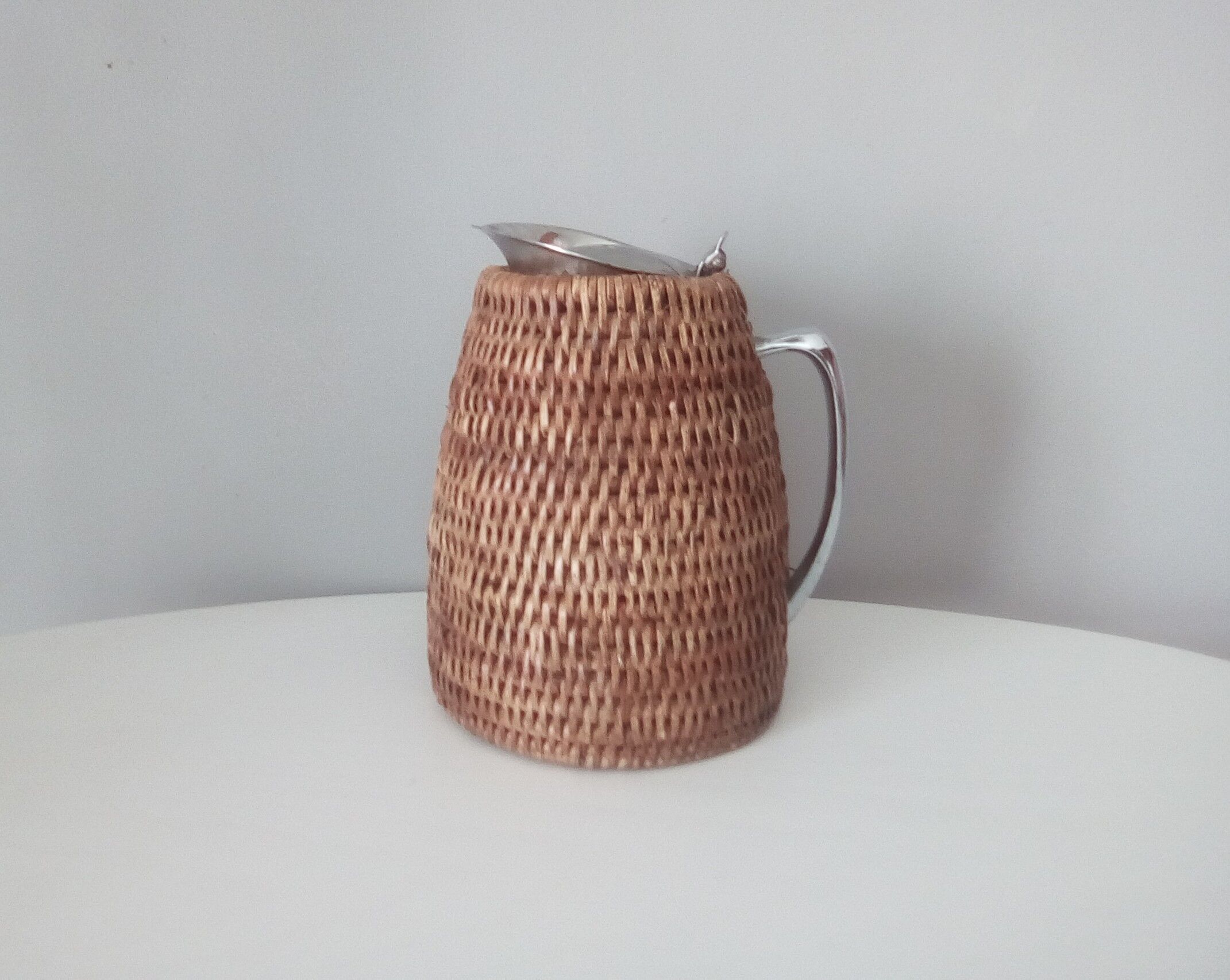 1980s rattan stainless steel pitcher