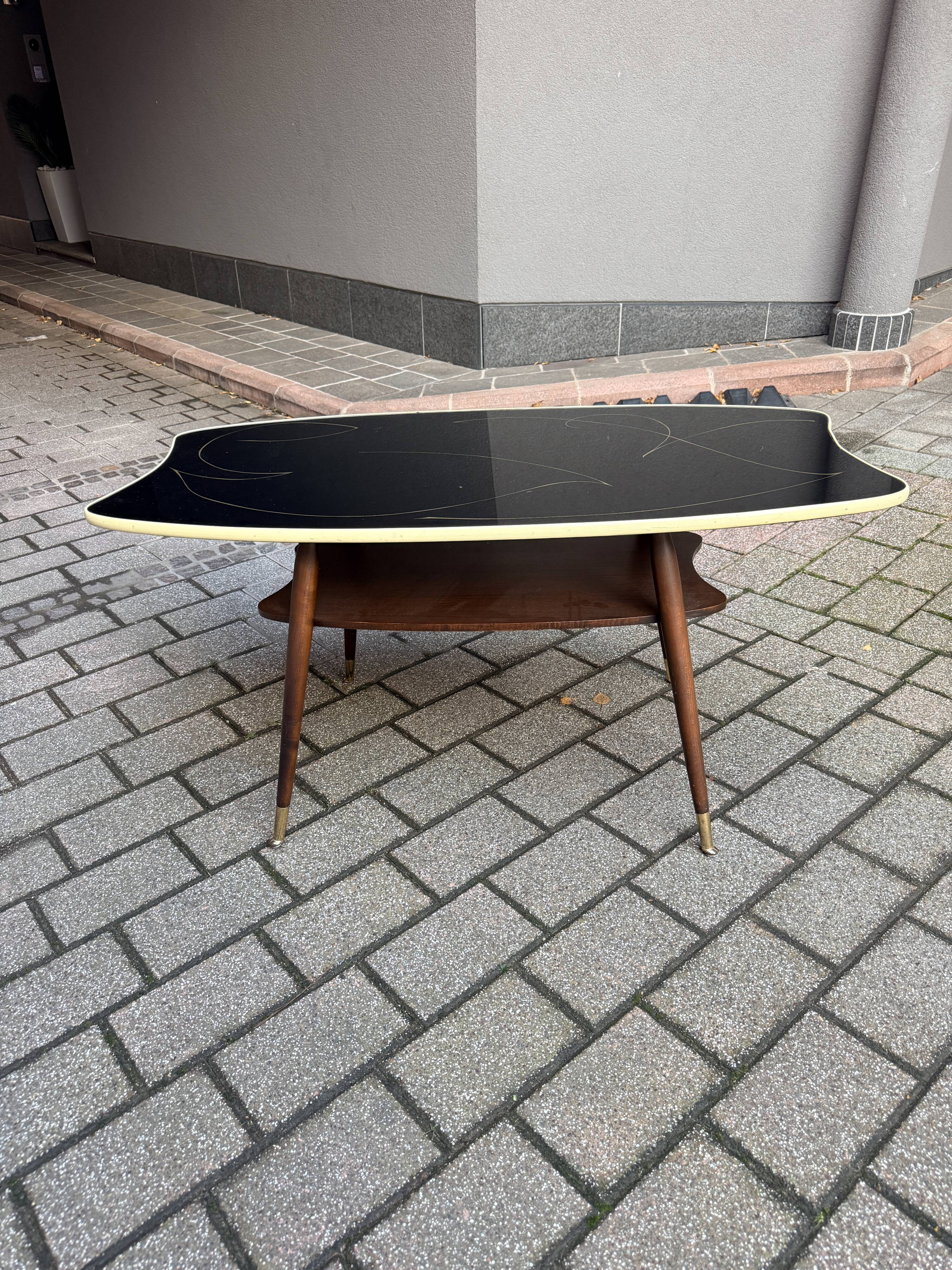 Black glass and wood coffee table