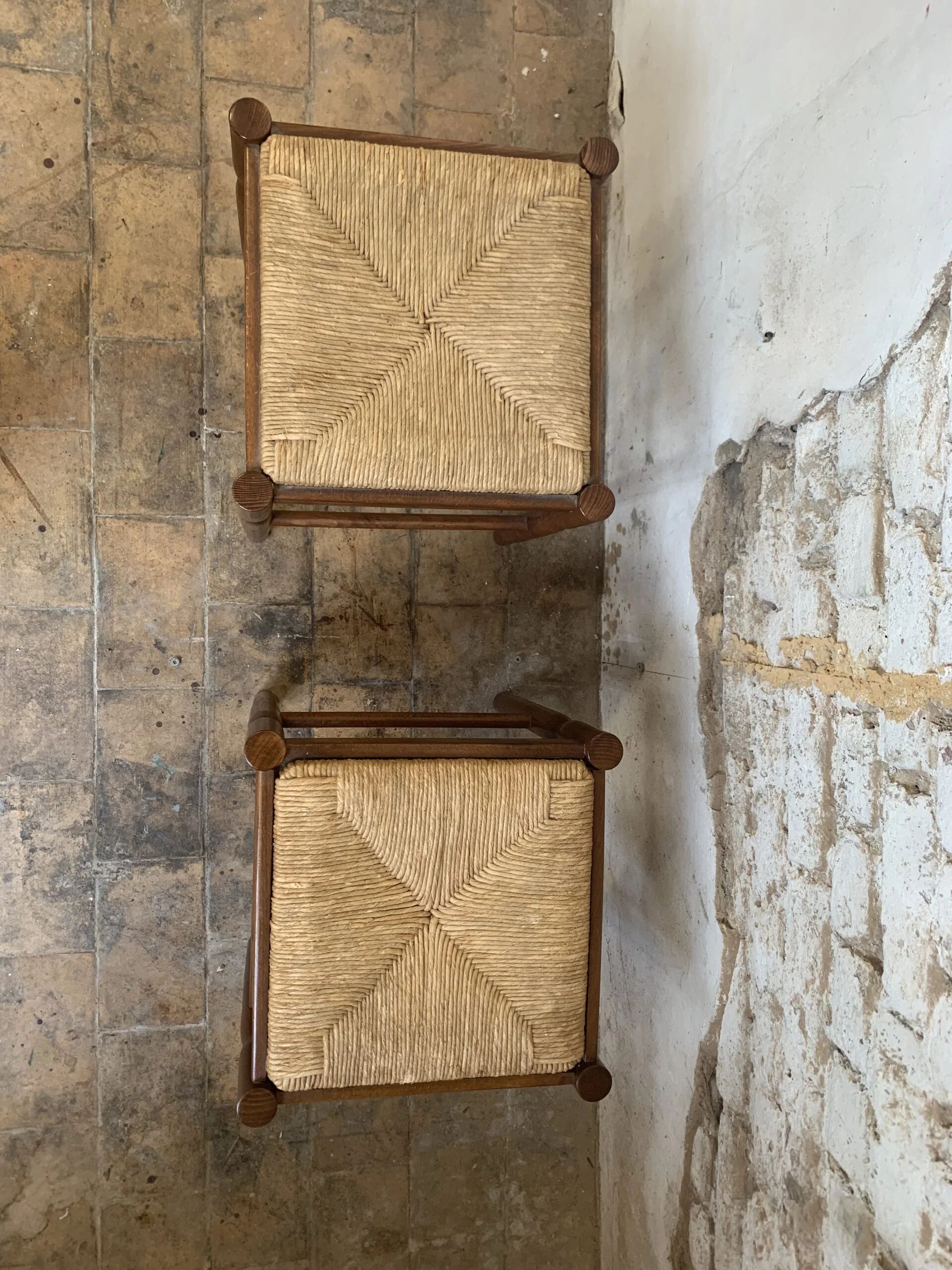 Pair of 20th-century wooden stools with straw seats