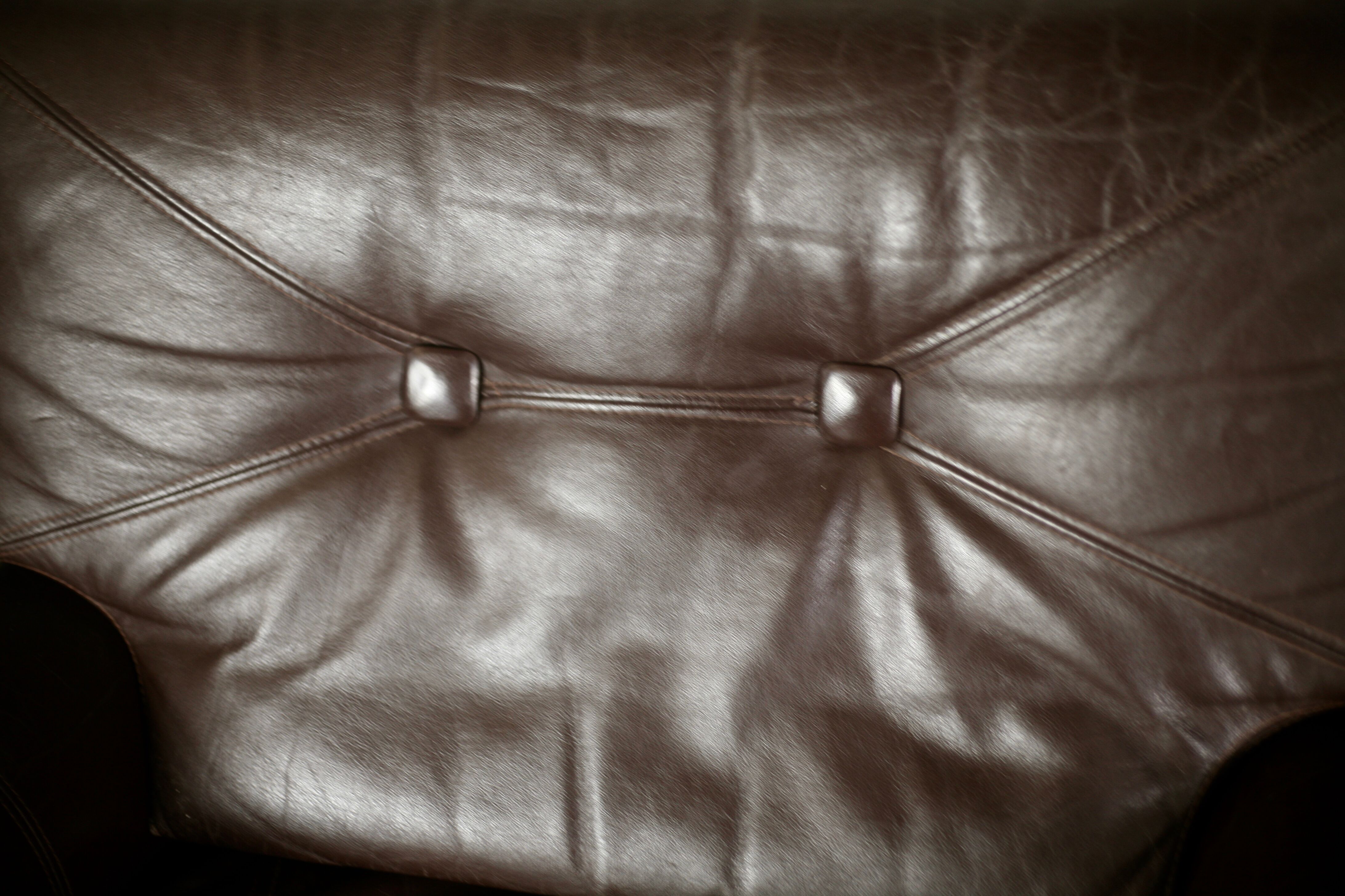 Pair of armchairs brown leather base stainless steel, France, circa 1970