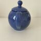 Vintage deep blue teapot, minimalist round shape.