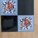 Wrought iron coffee table with square Gien ceramic patterns.