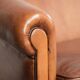 Sheepskin 2-seater sofa with a warm cognac brown colour scheme