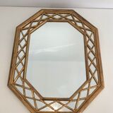 Octagonal mirror in gilded wood with closed guards