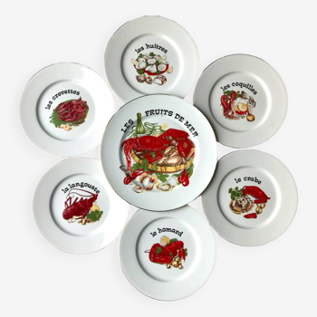 Twelve plates and a seafood dish in Limoges porcelain