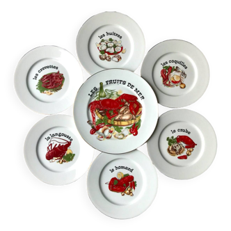 Twelve plates and a seafood dish in Limoges porcelain