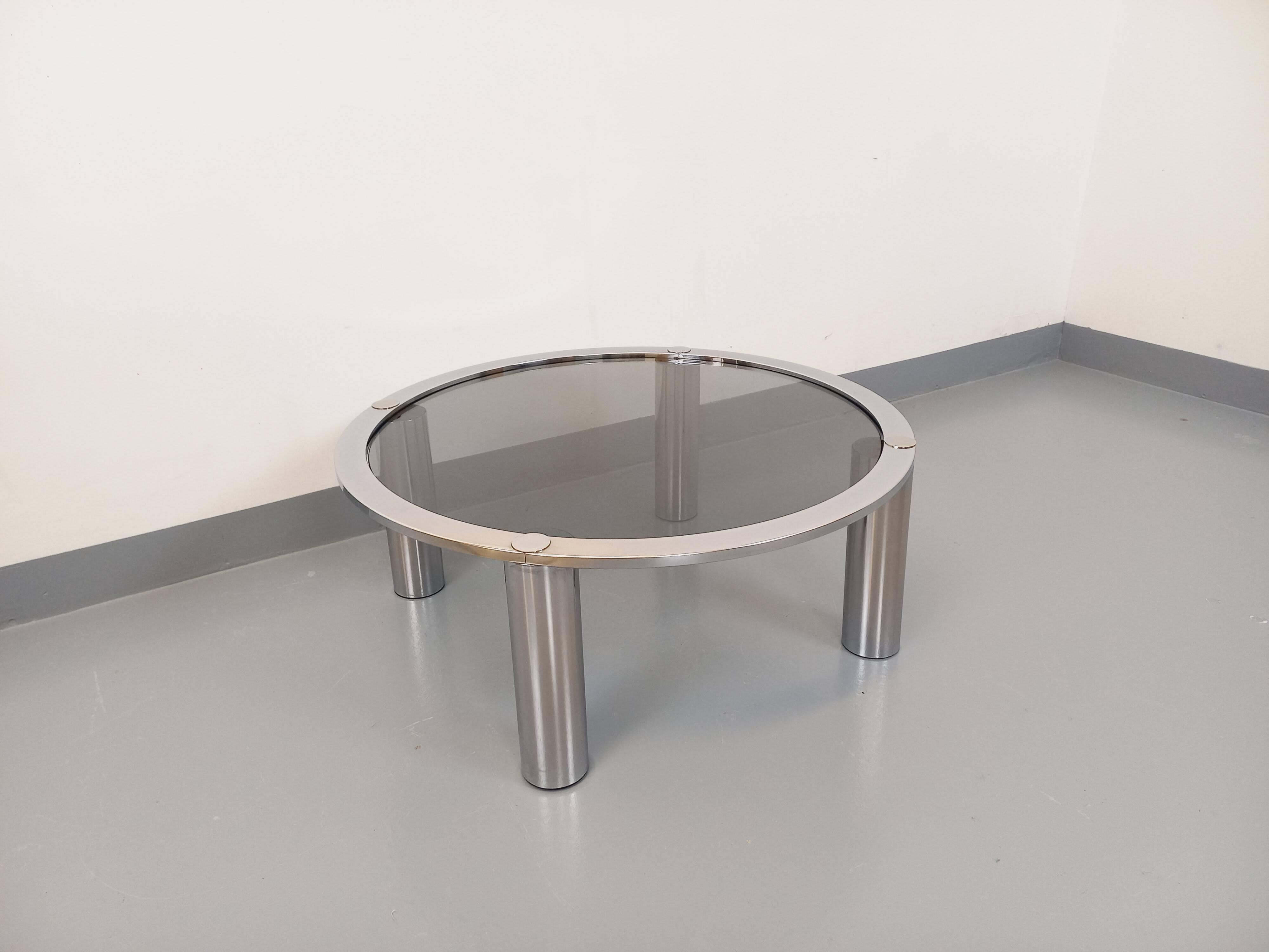 Vintage round coffee table in smoked glass and chrome metal from the 70s
