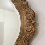 Bakelite scrolled mirror with rocaille pediment
