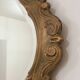 Bakelite scrolled mirror with rocaille pediment