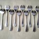 Set of 12 silver-plated oyster forks "Crossed Ribbons"