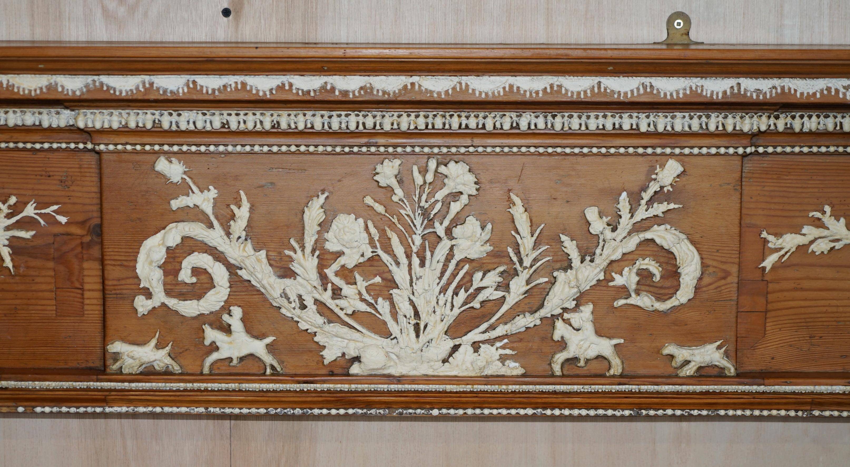 Victorian antique fireplace in tarred pine and sculpted gesso.